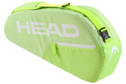 The HEAD BASE 3 Racket Tennis Bag S - SG, in lime green with "HEAD" in white, offers reinforced construction. It includes a front zippered pocket and an adjustable shoulder carry system, ensuring style and practicality for any athlete.