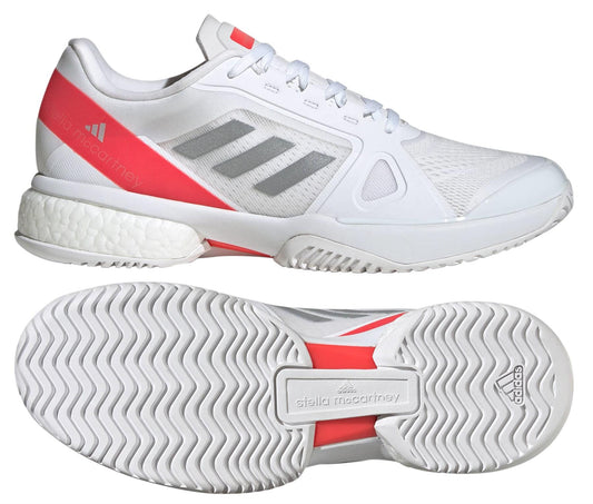 The ADIDAS Stella Court Women's Tennis Shoes in white and red feature a side mesh design, crafted from recycled materials with an energy-returning BOOST midsole. The top shoe is shown in a side view, while the bottom displays the sole pattern with branding.