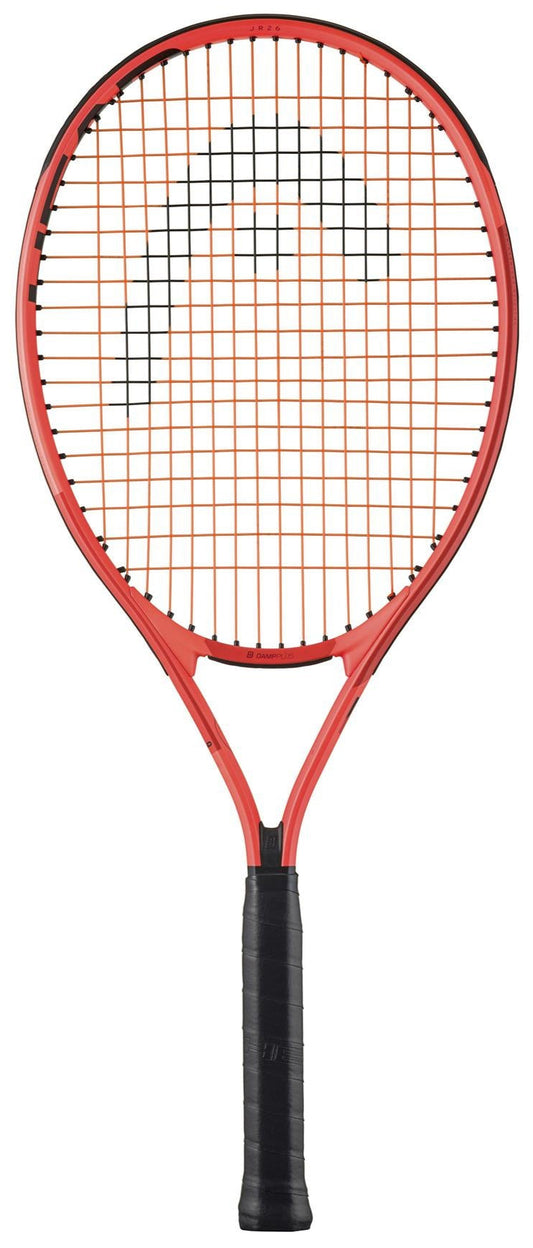 The HEAD Radical Junior 26 2025 Tennis Racket is a vibrant orange racket by HEAD, featuring distinctive detailing and a black grip handle. Enhanced with Damp+ technology, its striking design stands out against a plain white background.