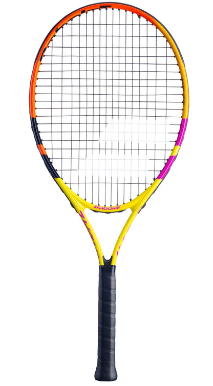 A vibrant Babolat Nadal Junior 26 Tennis Racket - G0 features a black grip and an orange, yellow, and pink frame. It has a traditional string pattern and is displayed against a plain white background.