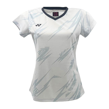 The Yonex YTL8 Women's Tennis T-Shirt in White/Charcoal is an athletic shirt featuring short sleeves, light gray abstract patterns, moisture-wicking fabric, a dark V-neck collar, and a small logo on the right chest—designed for performance-focused athletes.