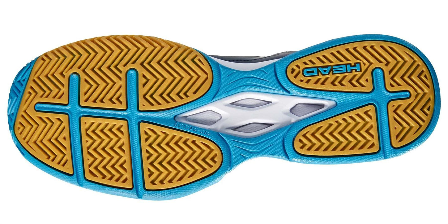 The image showcases the sole of the HEAD Grid 3.5 Indoor Court Tennis Shoes, featuring a bold zigzag tread pattern. The base is yellow with blue accents and a white central section. This shoe includes an EVA midsole and prominently displays the HEAD brand name in blue text against the yellow background.