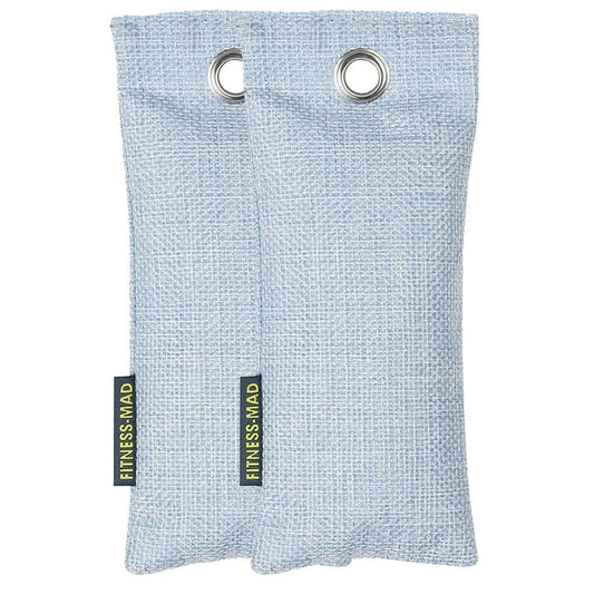 Two light blue fabric sachets with silver grommets and "Fitness Mad" tags. Each Fitness Mad Sports Odour Absorber pouch is infused with active charcoal, making it the perfect solution for deodorizing and efficiently absorbing moisture in sports environments.