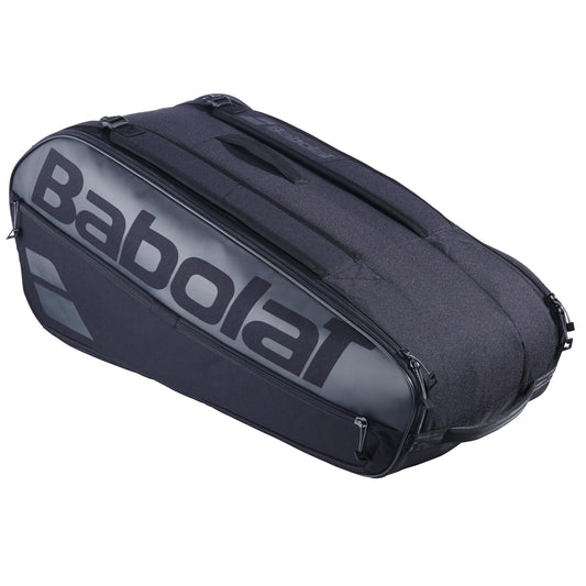 The Babolat Court L 9 Racket Tennis Bag in black showcases the brand name, features a zippered compartment and top handle for stylish racket storage, and is made with eco-friendly materials for sustainability-conscious players.