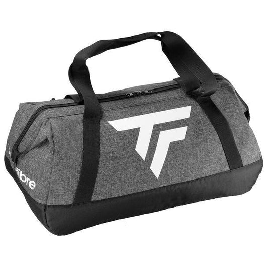 The Tecnifibre All Vision Tennis Duffle Bag in gray is ideal for racquet sports, featuring thick black handles and a prominent white logo on the side. It offers easy access with a wide-angle opening to its zippered main compartment, and is crafted from durable fabric.