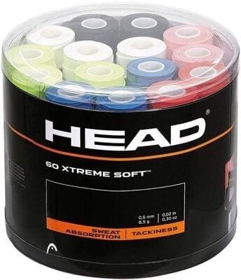 A cylindrical container showcases multicolored tennis overgrips from the "HEAD" brand. The packaging is labeled "HEAD Xtreme Soft 60pcs Box - Mixed," emphasizing its excellent absorption and tacky grip features. These overgrips are neatly displayed beneath a transparent lid, poised to elevate your performance on the court.