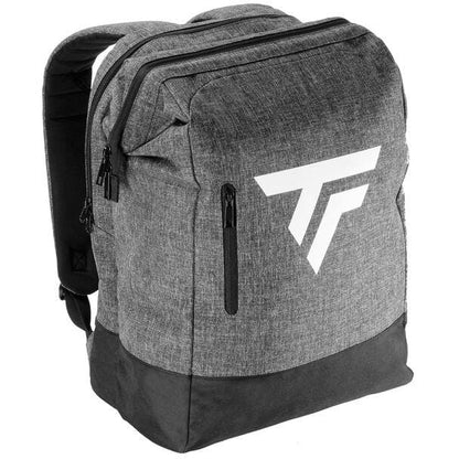 The Tecnifibre All Vision Tennis Backpack - Grey is perfect for racquet sports, showcasing a stylish gray design with a black base and two zippered compartments. It prominently features a large white geometric logo on the front and padded shoulder straps for added comfort, while its wide-angle opening ensures easy access.