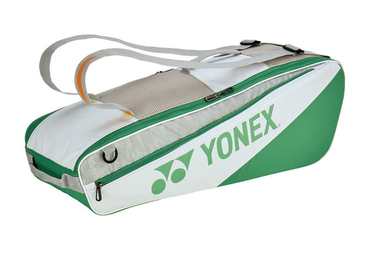 The Yonex 52526EX Club 6 Racket Tennis Bag - White features roomy compartments, two carry straps, and a separate shoe section for organized transport of your sports gear and rackets.