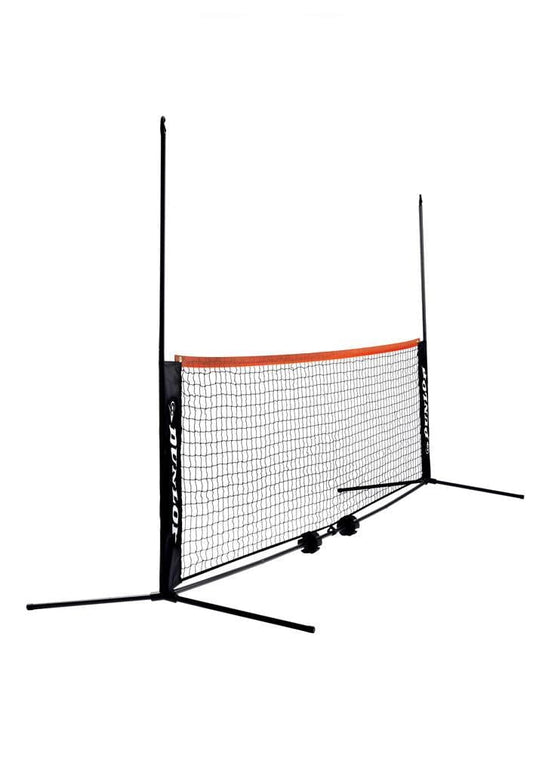 The Dunlop Mini 6m Tennis Net & Post Set, featuring a black frame with orange trim, is displayed on a white background. The side supports are marked with "Dunlop," and the base is designed for straightforward assembly and transport.