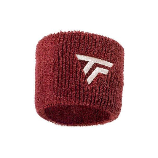 Introducing the Tecnifibre Tennis Wristband Sweatband 2 Pack in Cardinal: A textured maroon wristband with a distinctive white embroidered logo of stylized "T" and "F" letters inside a triangular shape. This absorbent sweatband is ideal for staying dry during intense matches.