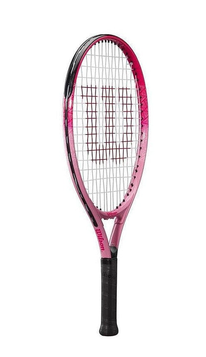 The Wilson Burn Pink 23 Junior Tennis Racket showcases a sleek pink and black design featuring a mesh string pattern, proudly displaying the emblematic Wilson logo on both the strings and handle. Its glossy frame is complemented by a black grip, offering an ideal lightweight option for young players.