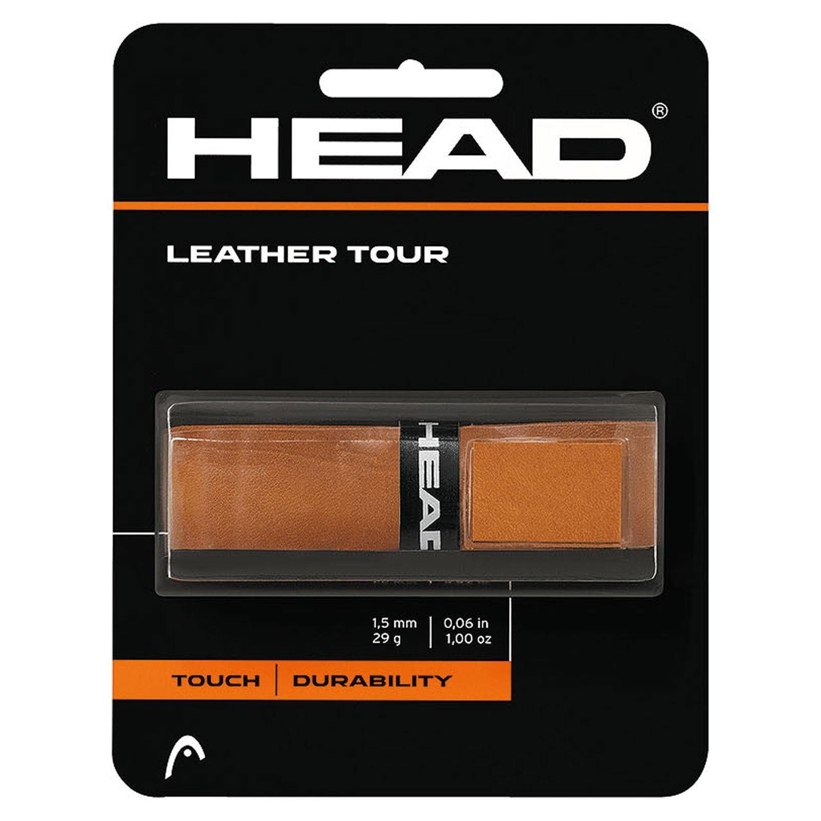 The HEAD Leather Tour Grip packaging features a striking black and orange design, with "TOUCH" and "DURABILITY" prominently displayed at the bottom. The genuine leather product is presented in a transparent section in the center, emphasizing its quality.