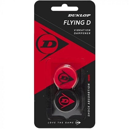 The packaging for the Dunlop Flying D Tennis Vibration Dampener - Red / Black features two silicone dampeners in red and black, each adorned with a "D" logo, highlighting their superior shock absorption capabilities.