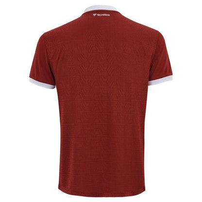 The Tecnifibre Men's Team Tennis Mesh Polo Shirt in Cardinal showcases subtle geometric patterns for optimum breathability. Made from polyester mesh fabric, it features white trim on the sleeves and a small logo at the back of the neck.