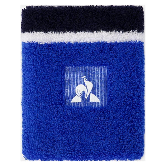 Introducing the Le Coq Sportif Tennis Sweatband in Lapis Blue—this fluffy, rectangular accessory showcases a striking blue and white design. It prominently features Le Coq Sportif's signature stylized bird logo in white set against a vibrant blue backdrop. The top section is adorned with a distinctive white stripe bordered by sleek black stripes.