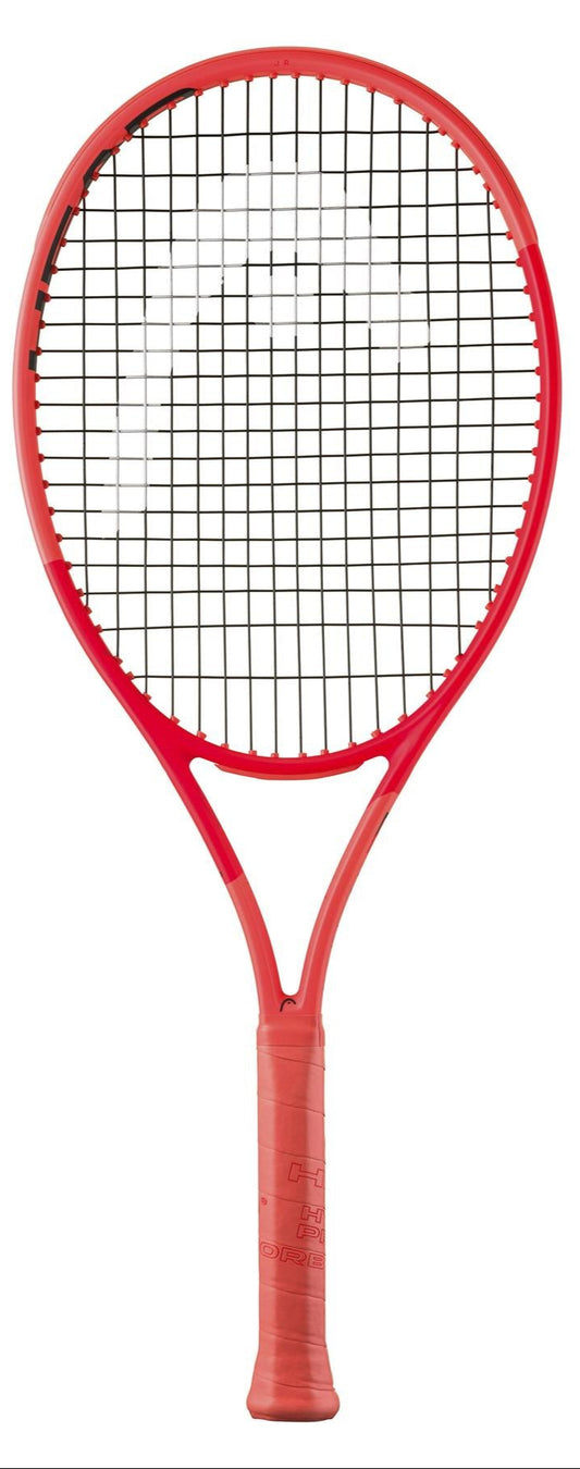 The HEAD Radical Junior 2025 tennis racket sports an orange design with a black string pattern. Its red handle, wrapped in grip tape, complements the frame enhanced by Auxetic 2.0 technology, set against a crisp white background for a sleek look.