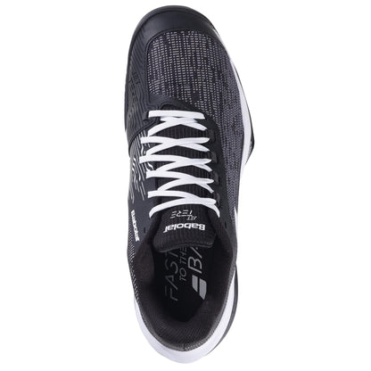 The Babolat Jet Tere 2 All Court 2025 Men's Tennis Shoes in black and white boast a sleek, ultra-lightweight design with mesh material, white laces, and branding on the tongue and side. The partially visible sole enhances its athletic look for comfort and stability.