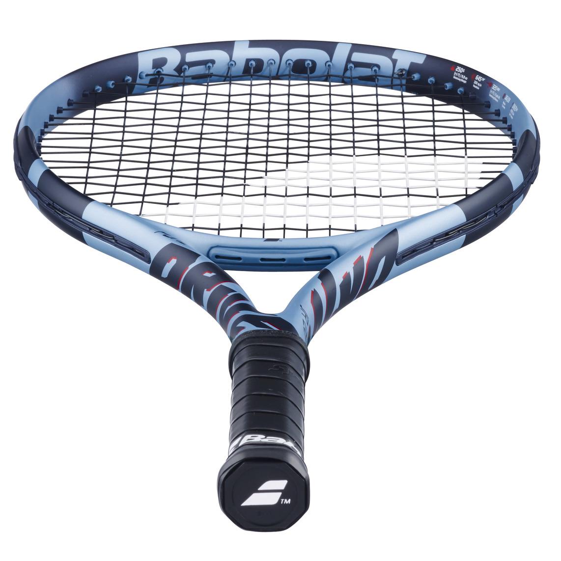 A close-up of the Babolat Pure Drive Junior 26 Gen 11 (Dark Blue) tennis racket highlights its blue and black frame. The brand logo appears on the handle and top edge, while its durable strings and cushioned grip suit advanced young players seeking performance and comfort.