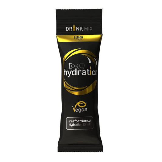 A black and gold packet labeled "Torq Hydration Sachet - Lemon" features a lemon flavor. This vegan performance hydration mix, from the Torq brand, boasts an advanced electrolyte delivery system that enhances your workout with its efficient hypotonic formulation.