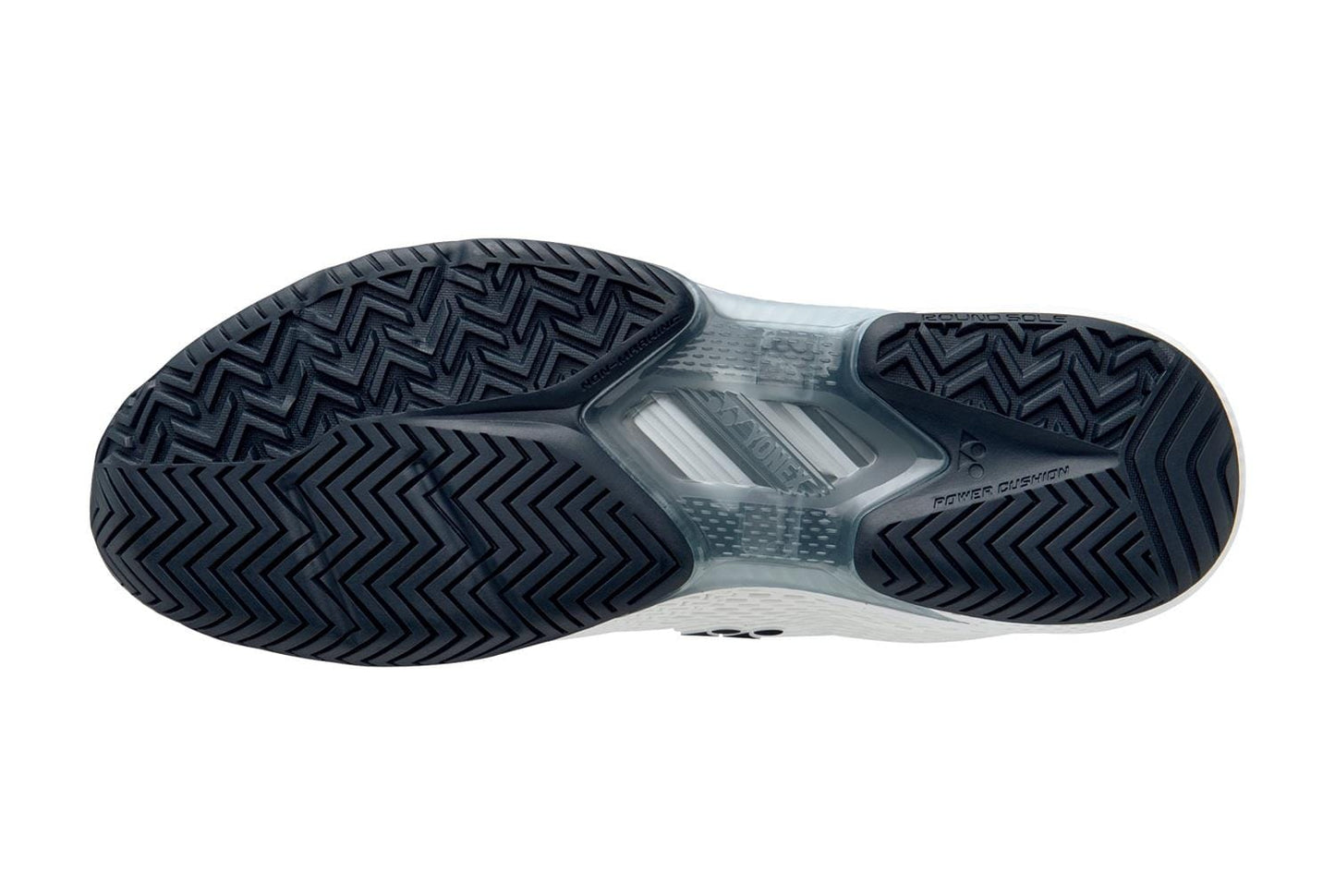 The image displays the sole of the Yonex Power Cushion Ad-Accel Men's Tennis Shoes in a white and black color scheme, featuring a zigzag tread pattern. The design emphasizes Accel-Booster technology for enhanced speed, with the Yonex logo embossed near the heel.