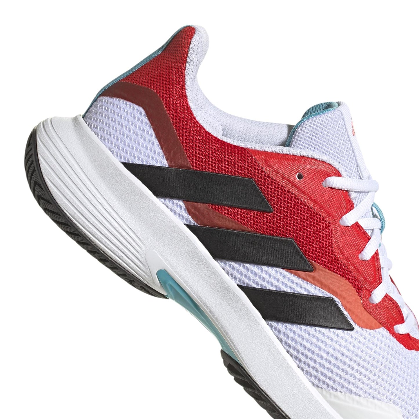 Detailed view of the adidas CourtJam Control Men's Tennis Shoes, showcasing an engineered mesh upper in a white base with striking red accents and iconic black stripes. The sneaker is equipped with a textured white midsole featuring bounce cushioning and finished with a durable black rubber outsole. It also includes white laces and contrasting blue interior details.