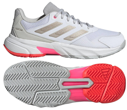 The ADIDAS CourtJam Control 3 Women's Tennis Shoes in White/Red feature a Bounce midsole for comfort, a gray and pink sole for grip, and have visible laces with a mesh-like upper. Perspective views show both the side and the sole.