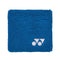 The Yonex AC493 Wristband - Blue by Yonex is a square blue sweatband with a textured surface, featuring a small white logo in the corner, designed to keep you cool and dry.