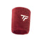 The Tecnifibre Tennis Wristband Sweatband XL - Cardinal is a red sweatband with a white logo featuring the intertwined letters "T" and "F." Its textured, stretchy fabric makes it an absorbent wristband ideal for intense matches.