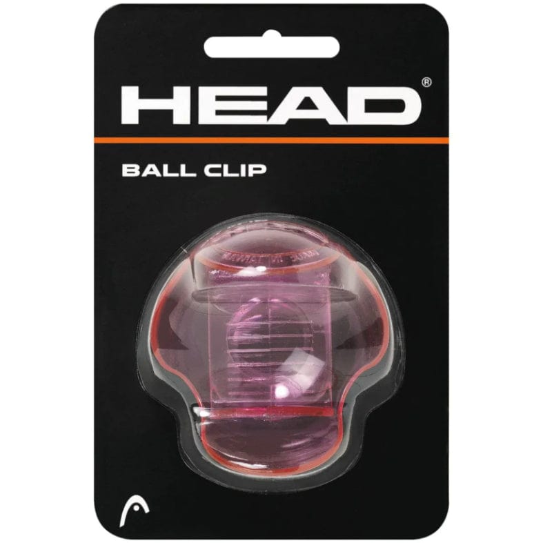 Packaging for the Head Tennis Ball Clip Holder in red, showcasing a transparent, oval device made from sturdy material to firmly hold tennis balls. The lightweight design prominently displays "HEAD" at the top in white lettering on a black background.