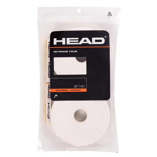 Displayed is the HEAD Prime Tour Overgrip (30 Pack) - White. The clear plastic packaging features black and orange branding and holds multiple white overgrips designed to provide extra feel, enhanced tackiness, and ultimate comfort for every match.