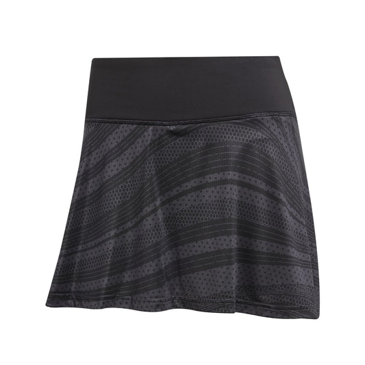 The ADIDAS Women's Club Graphic Tennis Skirt - Black features a high waistband and dotted diagonal stripes. Crafted from recycled materials, its lightweight fabric includes CLIMACOOL technology, ideal for sports or casual wear.