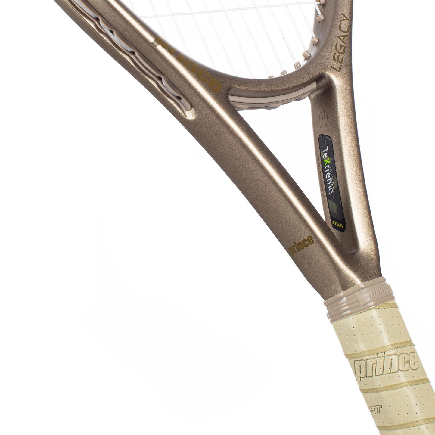 Close-up of the Prince O3 Legacy 120 2025 Tennis Racket in gold, featuring TeXtreme technology for durability, a grip with "prince" printed on the handle, and technological detailing near the frame to highlight its large sweet spot.