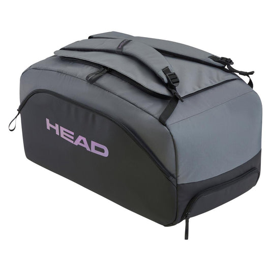 The HEAD Pro X Tennis Duffle Bag in Black/Dark Grey is crafted from recycled PET bottles, featuring the word "HEAD" in purple. It's a sustainable choice with multiple compartments, zippers, and two padded shoulder straps for easy carrying.