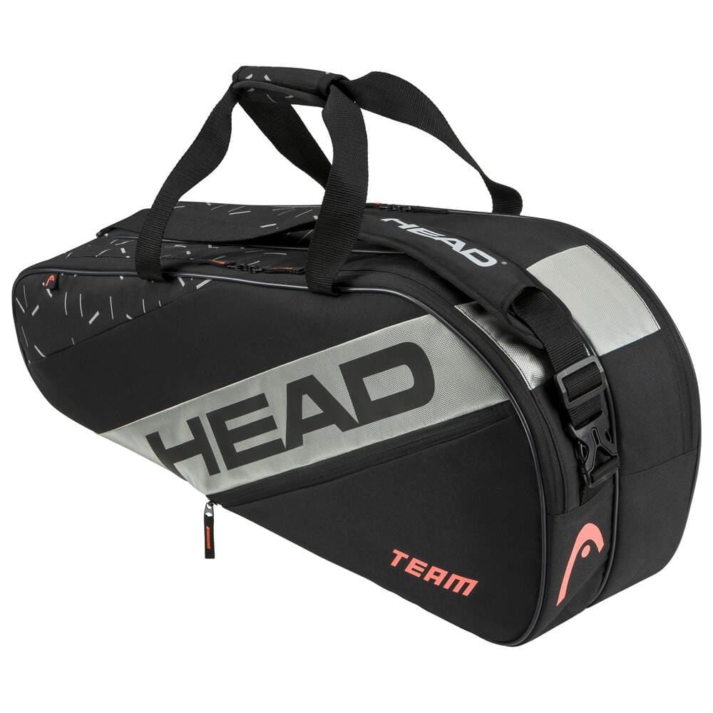 The HEAD Team 6 Racket Tennis Bag M - BKCC, designed with a sleek black and gray color scheme, prominently displays the brand name "HEAD" on its side. It comes with robust black handles and a versatile 2-way carry system. Additional storage compartments are highlighted by the word "TEAM" and a subtle logo, adding an elegant touch to the bag.