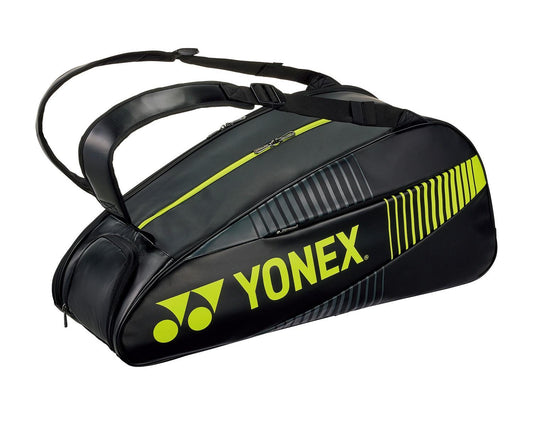 The Yonex 82426EX Active 6 Racket Tennis Bag in black and lime features multiple compartments, including a thermo-lined one, two shoulder straps, and a sleek design with the Yonex logo prominently displayed.