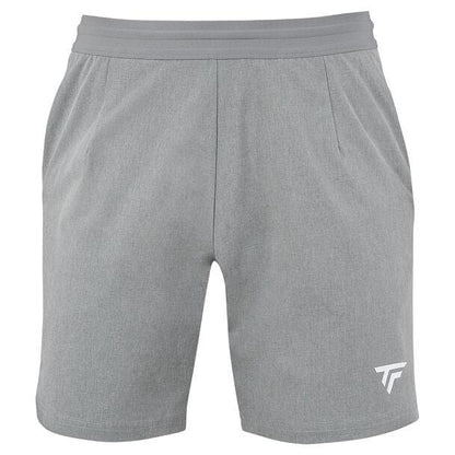 Silver athletic shorts featuring an elastic waistband and a subtle white logo on the lower left leg, branded as the Tecnifibre Mens Team Tennis Short. These shorts are lightweight and ventilated, perfect for both sports activities and casual wear.