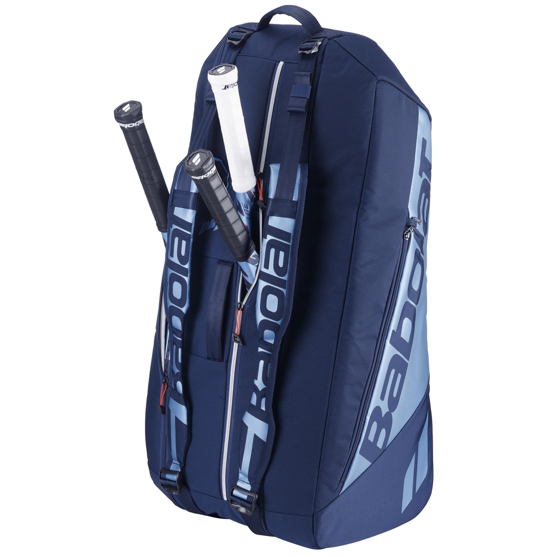 The Babolat RH6 Pure Drive Gen11 Tennis Bag in navy blue, featuring light blue accents and a large capacity with multiple compartments, can hold six rackets. Three rackets are partially visible with black and white grips. The brand name "Babolat" is boldly printed on the bag.