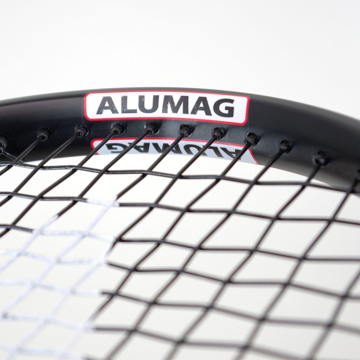 Close-up of the Karakal Comp 27 Tennis Racket, a beginner level racket featuring the word "ALUMAG" etched on its sleek 7050 Alumag Alloy frame. Its tightly woven strings enhance precision. Set against a plain white background, this stylish black and white racket from Karakal is ideal for those new to the game.