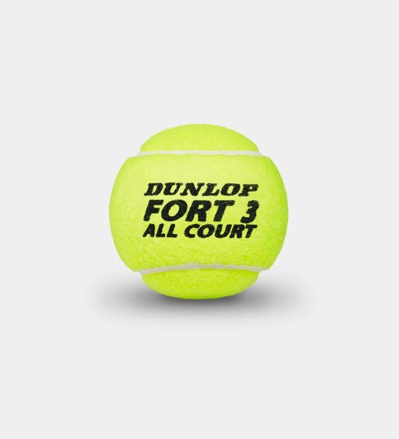 A yellow tennis ball from Dunlop's Fort All Court series, packaged in a 3 ball tube, showcases black text on a light gray backdrop and incorporates Dunlop HD Core technology. It is ITF approved for superior performance.