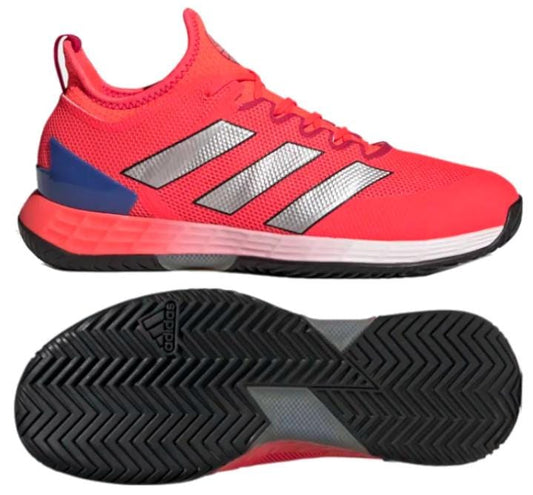 The Solar Red adidas Adizero Ubersonic 4 Men's Tennis Shoes feature gray and white stripes along with a blue heel accent. Engineered for speed-enhancing performance, they are equipped with a black herringbone-patterned sole that provides optimal traction on the court.