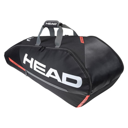 A black and orange HEAD Tour Team 6R Combi tennis bag prominently displaying the brand name "HEAD" in large white letters. This sleek, aerodynamic sports duffel is ideal for transporting your equipment and includes gray handles as well as advanced Climate Control Technology to safeguard your gear.