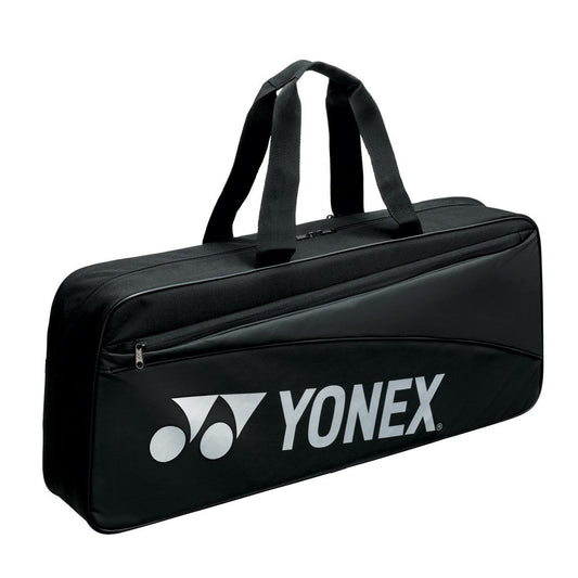 Presenting the Yonex 42331WEX Team Tournament Bag - Black, featuring an elegant design with striking white text, ideal for stylishly transporting your essentials.