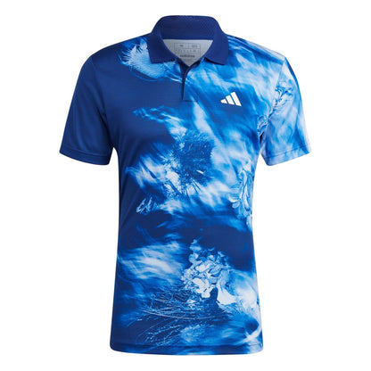 Introducing the adidas Melbourne Mens Freelift Tennis Polo Shirt in Blue. This stylish polo features a distinctive tie-dye pattern with a white logo on the chest, capturing the essence of the Australian Open. The design blends various shades of blue and white to create a captivating swirling effect. Ideal for tennis enthusiasts, this short-sleeved shirt with its button-up collar perfectly embodies the Melbourne mens tennis polo style by adidas.