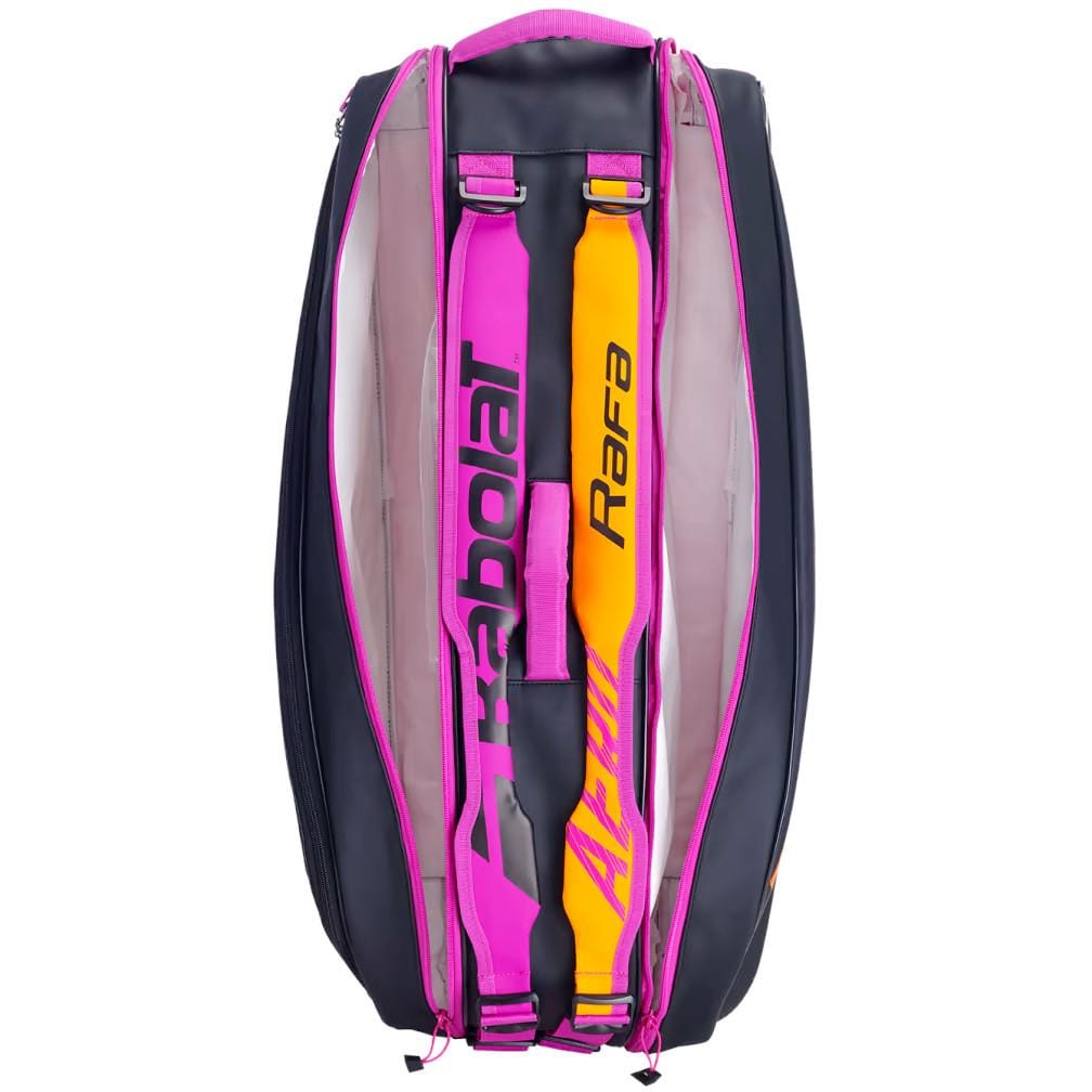 The Babolat RH6 Pure Aero RAFA 6 Racket Tennis Bag in black, orange, and purple features "Rafael Nadal" on the straps. It includes multiple compartments with an insulated one and offers a durable design ideal for carrying tennis equipment.