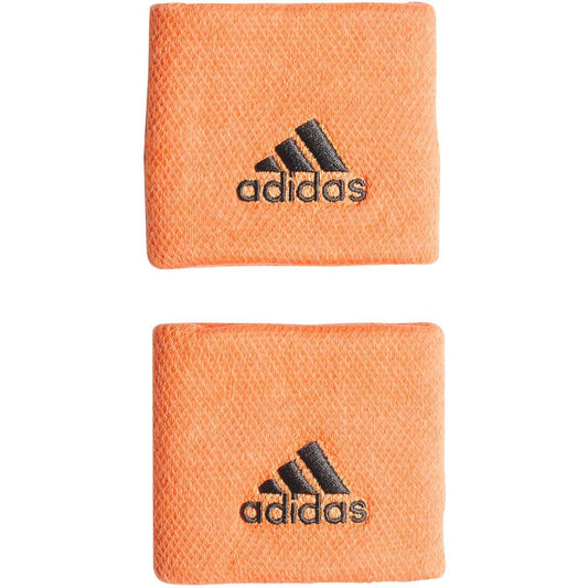 These sweat-absorbent adidas Tennis Wristband Sweatbands in orange, showcasing the iconic black Adidas logo, are ideal for tennis lovers. Crafted from recycled materials, they perfectly blend sustainability with performance.