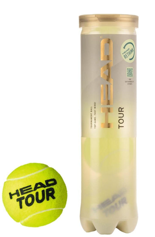 A tube of HEAD Tour Tennis Balls - 4 Ball Tube is showcased alongside a vibrant yellow ball inscribed with "HEAD TOUR." Featuring a gold and cream design, the tube prominently displays the HEAD logo. These official tournament balls are enhanced with Dynamic (EN)Core technology for superior performance.