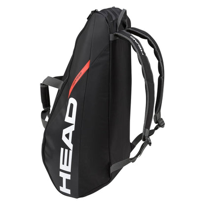 A black HEAD Tour Team 6R Combi tennis bag with "HEAD" printed in white on the side. This backpack includes adjustable shoulder straps, an orange accent line, and a zippered compartment for storing tennis equipment, featuring Climate Control Technology for optimal gear protection.