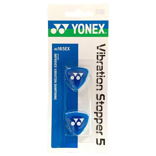 Packaging of the Yonex AC165 Tennis Vibration Damper in Black/Blue. This package includes two blue dampeners marked with the Yonex logo, designed to minimize vibrations in tennis or badminton rackets. The packaging highlights "Improved Vibration Dampening.