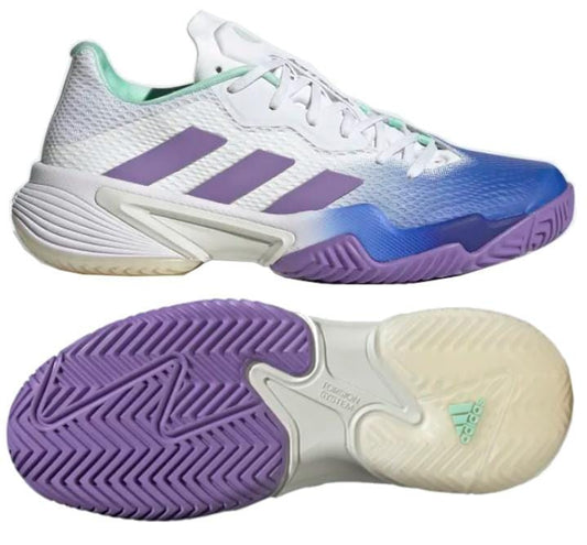 The adidas Barricade Women's Tennis Shoes come in a Lucid Blue base, featuring Violet Fusion and Pulse Mint accents. They highlight striking purple stripes along the sides, complemented by a textured sole that blends shades of purple and cream. Crafted with recycled materials, these shoes emphasize sustainability without compromising style.